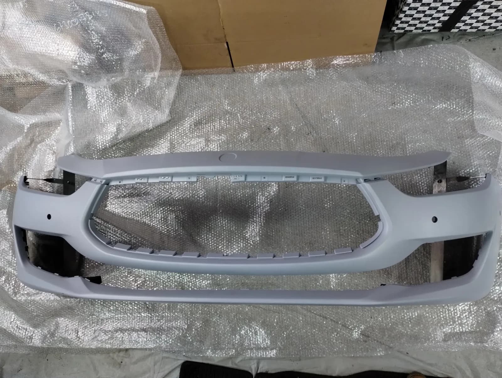 Genuine Maserati Ghibli front bumper. Part number 6730078185.